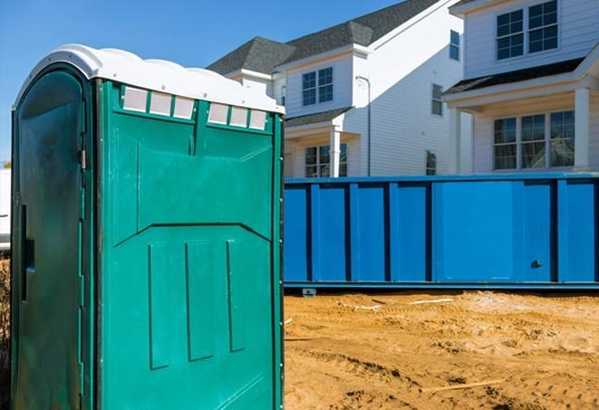 a line of durable porta potties for busy construction workers